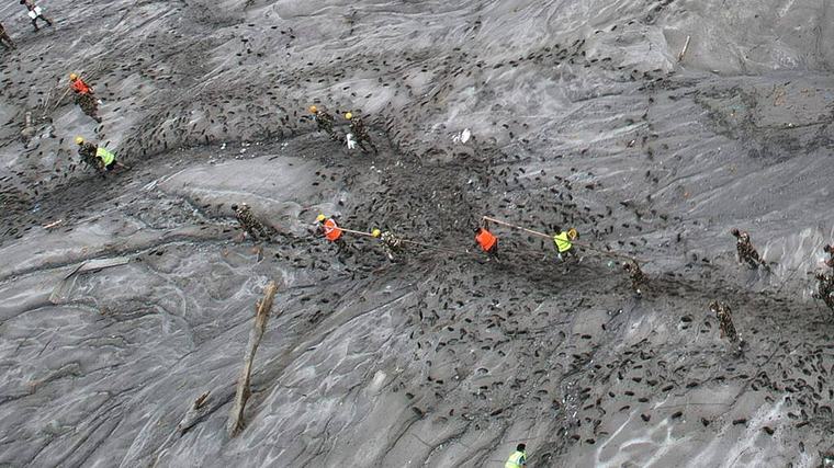 Mass burials in Nepal as death toll from flash floods exceeds 1,000