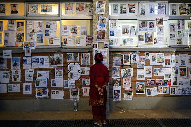 Nepal begins mass burials of unidentified flood victims as families seek missing